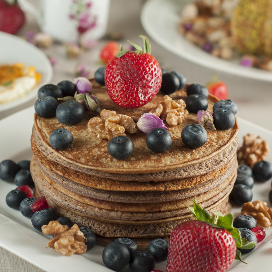 tack of chocolate pancake with fruit and nuts